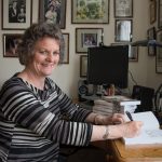 Susan Gandar at desk smiling